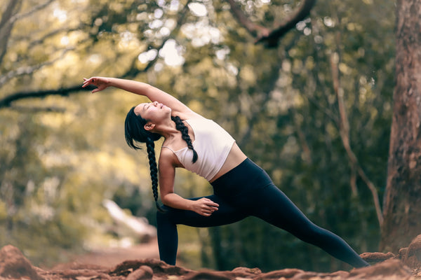 women doing yoga in the forest after taking CBD for inflammation