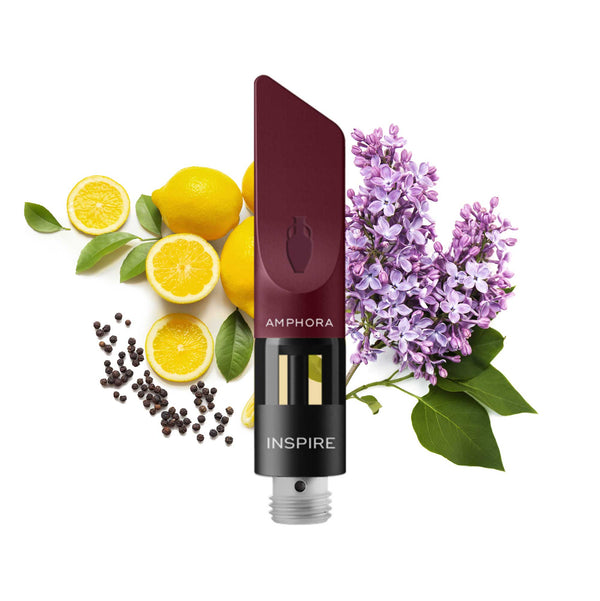 INSPIRE CBD Vape Cartridge in front of Lilac flowers and Lemons  