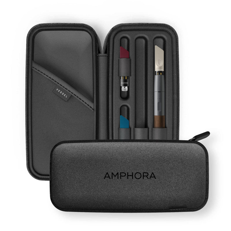 Open Charcoal Amphora Vape Pen Case containing a Walnut Craftsman Vape Pen connected to a MEND Infused CBD Vape Cartridge, an INSPIRE Infused CBD Vape Cartridge, and a ZZZ Infused CBD Vape Cartridge, with another Charcoal Amphora Vape Pen Case In front of it 