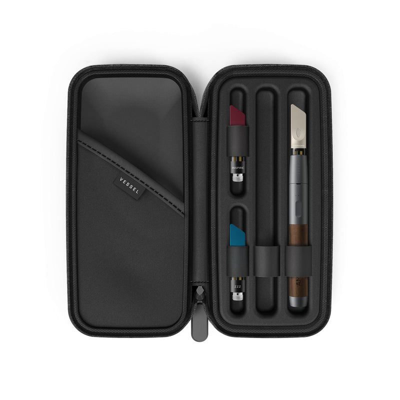 Open Charcoal Amphora Vape Pen Case containing a Walnut Craftsman Vape Pen connected to a MEND Infused CBD Vape Cartridge, an INSPIRE Infused CBD Vape Cartridge, and a ZZZ Infused CBD Vape Cartridge 
